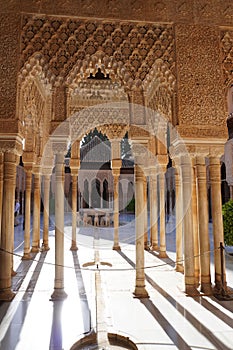 The Court of Lions hall details architecture of Alhambra Palace from Granada City. Spain