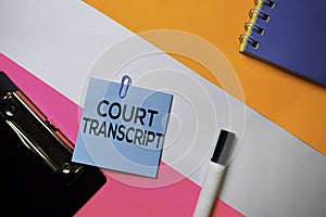 Court Transcript text on sticky notes with color office desk concept
