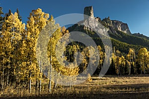 Courthouse Peak Mountain outside Ridgway Colorado shows Cimarron Mountains in autumn aspen colors