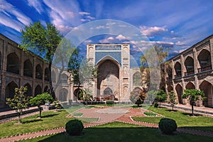 courtyard of ancient Uzbek Kukeldash Madrasah in Tashkent in Uzbekistan. Old medieval Islamic madrasa in summer