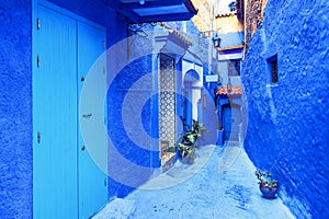 Courtyard with blue walls of houses in old medina of Chefchaouen. Morocco, North Africa