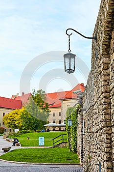 The courtyard is buried in flowers and greenery in the ancient Zamek Krolewski na Wawelu Castle in the center of Krakow