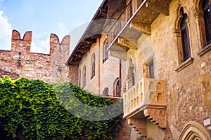 Courtyard of Casa di Giulietta House of Juliet with famous balcony of Juliet from drama William Shakespeare Romeo and Juliet in photo