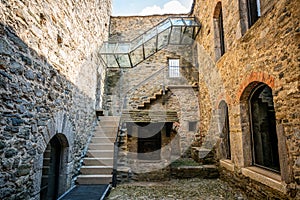 Courtyard and entrance of museum in middle of Montebello castle church in Bellinzona Switzerland