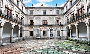 Courtyard of the Fountainheads (Patio de los Mascarones) at Royal Monastery of San Lorenzo de El Escorial near Madrid, Spain