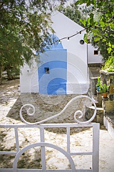 Courtyard in front of traditional Greek small Orthodox Chapel. Agios Nikolaos. Crete, Greece.
