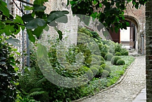 Courtyard garden at 15th century Jerusalem Church Jeruzalemkerk, Bruges / Brugge, Belgium.