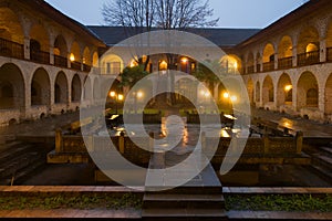 The courtyard of the Great Caravansary was raining January evening. Sheki, Azerbaijan