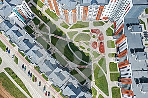 Courtyard of modern residential buildings with playground. aerial view