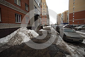 courtyard multi-storey ghetto housing melting black snow