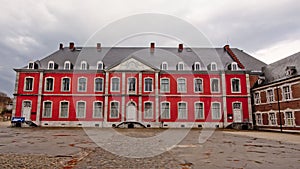 Courtyard with neo classical building of Stavelot abbey on a cloudy day