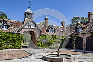 Courtyard of an old country house with fountain.
