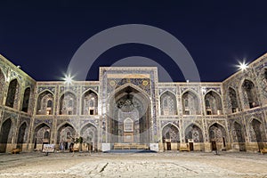 The courtyard of the Sherdor Madrasah is illuminated at night. Registan Square in Samarkand,