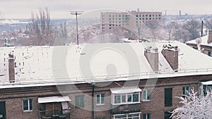 Courtyard view of the Snow Covered Roofs of Old Residential Buildings