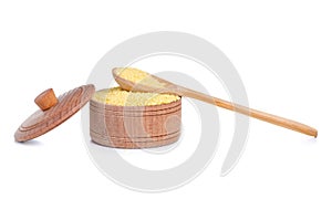 Cous cous in wooden bowl with lid and wooden spoon