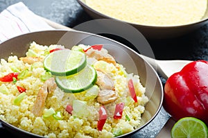 Couscous with grilled chicken meat and vegetables