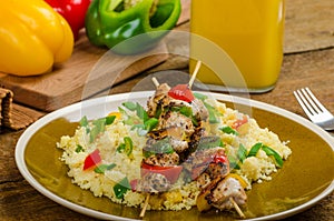 Couscous with vegetables and chicken skewer