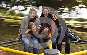 Cousins on a merry go round