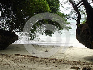 Cove of white sand beach at the rock islands in Palau