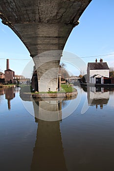 Coventry canal waters oxford canal route reflections of bridge and buildings hawkesbury junction