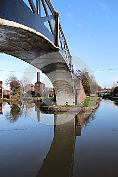 Coventry canal waters oxford canal route reflections of bridge and buildings hawkesbury junction