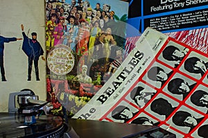 Cover of the famous Beatles Abbey Road album with a turntable in the foreground.