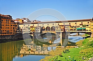 A covered bridge over the Arno river in Florence Italy.