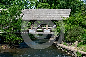 Covered Bridge over the DuPage River along the Naperville Riverwalk in Naperville during Summer