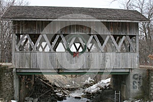 Covered Bridge over a frozen creek
