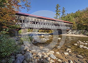 Covered bridge over a river in the state of New Hampshire