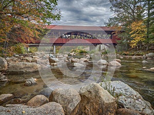 Covered bridge over a river in the state of New Hampshire