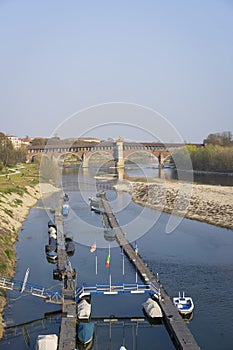 Covered bridge over the Ticino river in Pavia vertical photo
