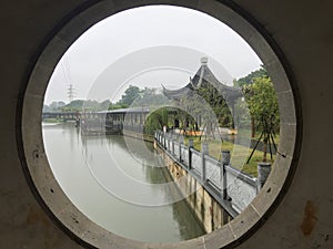 Covered bridge in rain-Jiangnan garden