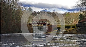 Covered Bridge and Waterfall with Reflecting Lake