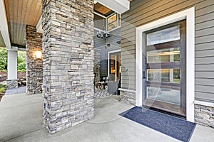 Covered porch accented with stone column