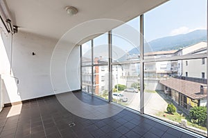 Covered terrace with large windows and views