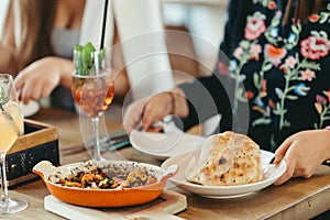 covered Turkish restaurant table with a shrimp and veggies casserole