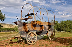 A covered wagon without the white canvas top