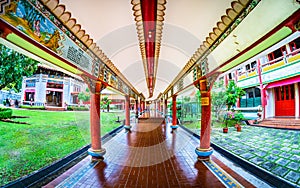 Covered Walkway beside Sangha Quarters and Hall of Precepts at The Kong Meng San Phor Kark See Monastery in Bishan, Singapore.