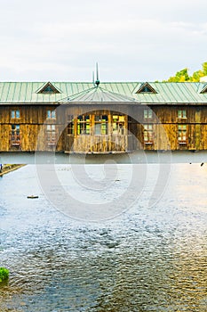 Covered wooden bridge in the town of Lovech in Bulgaria over the Osam river...IMAGE