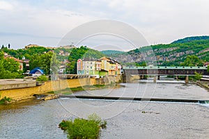 Covered wooden bridge in the town of Lovech in Bulgaria over the Osam river...IMAGE