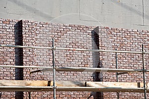 covering wall with bricks construction fasade