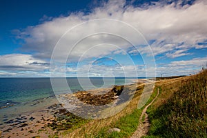 Covesea Skerries Lighthouse on the empty beach