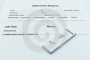 Covid-19 antigen rapid test device on a Laboratory Report Module.