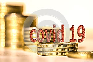 ,, Covid 19 ` on a background of coins and money .