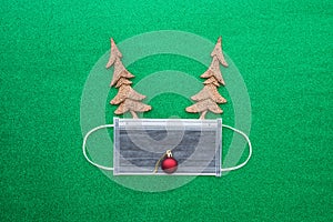 Covid-19 in Christmas festival celebration concept. Flat lay of Christmas xmas reindeer made from pine tree decorative object