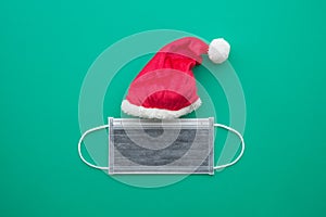 Covid-19 in Christmas festival celebration concept. Flat lay of festive Christmas xmas made from santa claus hat