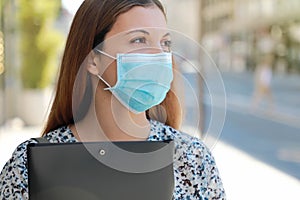 COVID-19 Close UP Unemployed Worried Girl with Surgical Mask Looking for a Job Walking in City Street Delivering Curriculum Vitae