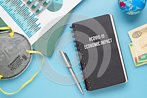 COVID-19 or Corona virus Economic IMPACT background concept. Mockup Notebook for Covid 19 Economic impact anlysis with busines