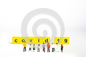 Covid-19 Coronavirus Concept - Miniature figurienes, still object on white background, shallow depth of field